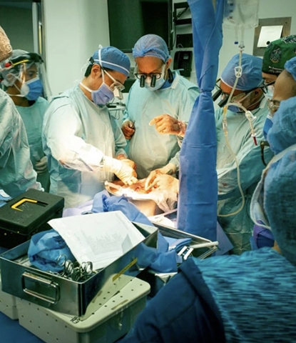 Dr. Kato and Dr. Rivas working side by side in the OR in Caracas.