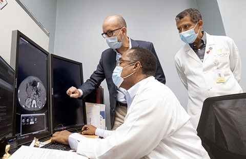 The team in the Dominican Republic prepares for months before transplant. Here they review scans. (Image courtesy of FundaHigadoAmerica)