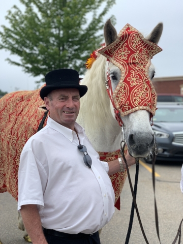 Kieran poses with one of his horses
