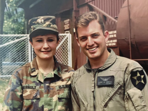 two army cadets stand together and pose