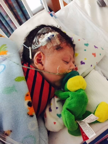 ethan in the NICU hosptial bed sleeping