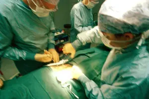 Photo of medical students performing surgery