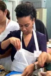 Eileen Fuentes helping with a cooking demonstration during 2013 Wellness Series