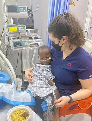 Columbia/NYP nurse cares for patient in ICU