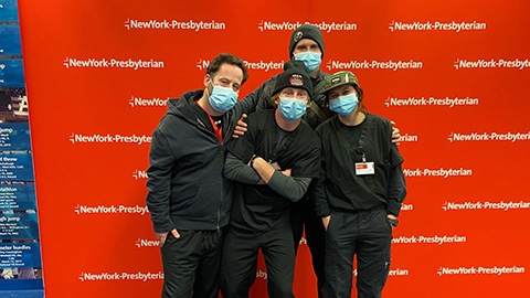Noah Landguth and Joe Lorenz with vaccine volunteers at the Armory.