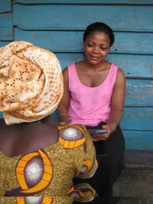 A nursing student in Sierra Leone uses an iPad to collect surgical data.