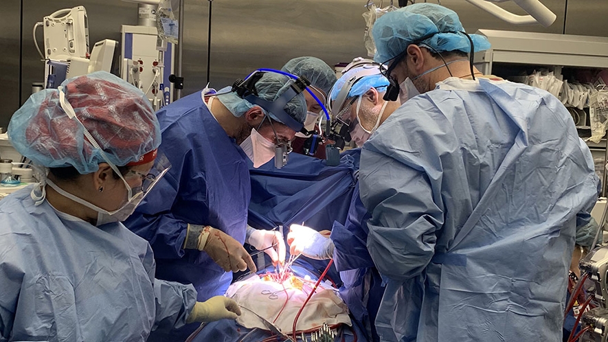 Dr. Kalfa, Dr. Bacha, Dr. Goldstone and the surgical team working on Brooklyn’s heart valve transplant. (Image courtesy of NYP)