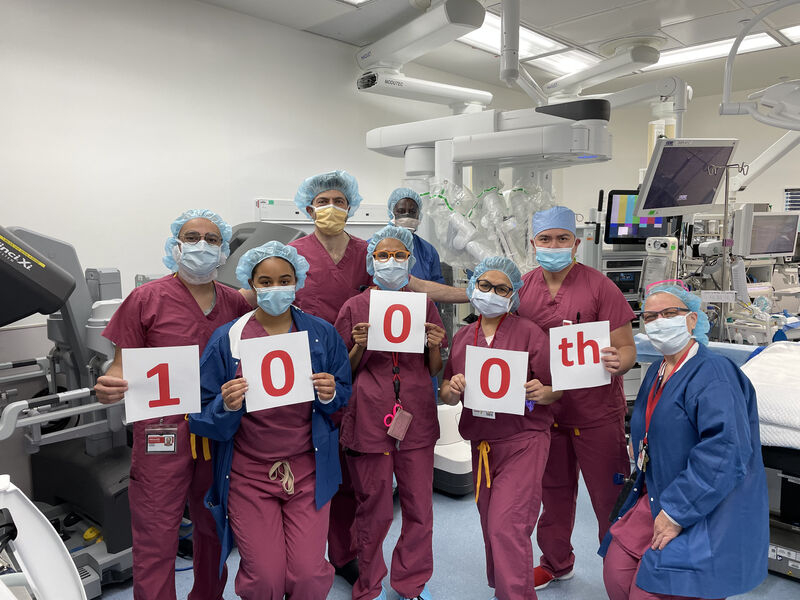 A surgical team celebrates the 1000th robotic surgery