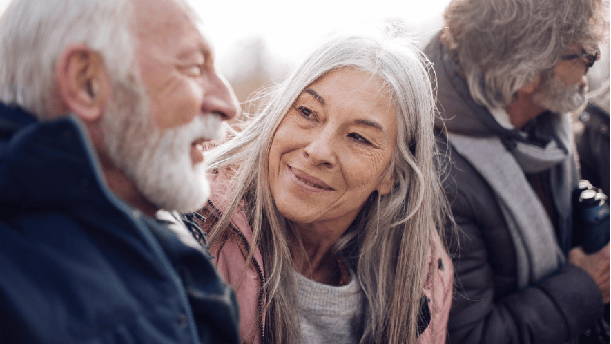 Photograph outside of woman looking at man
