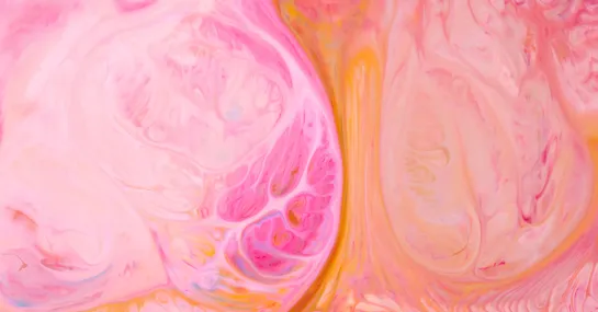 Abstract background with colored spots and stains on the liquid