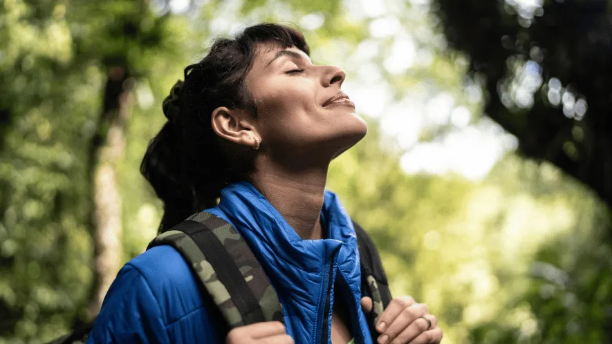 Photo of woman in woods smiling