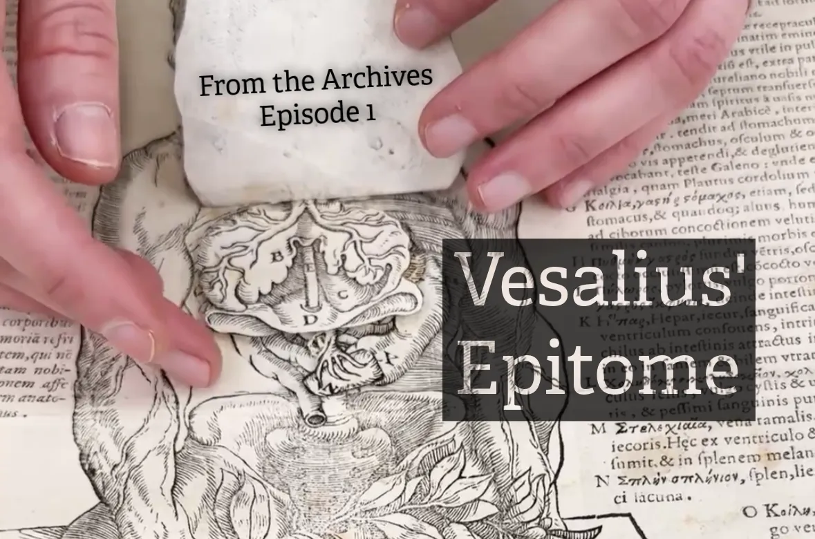hands flipping through vesalius epitome