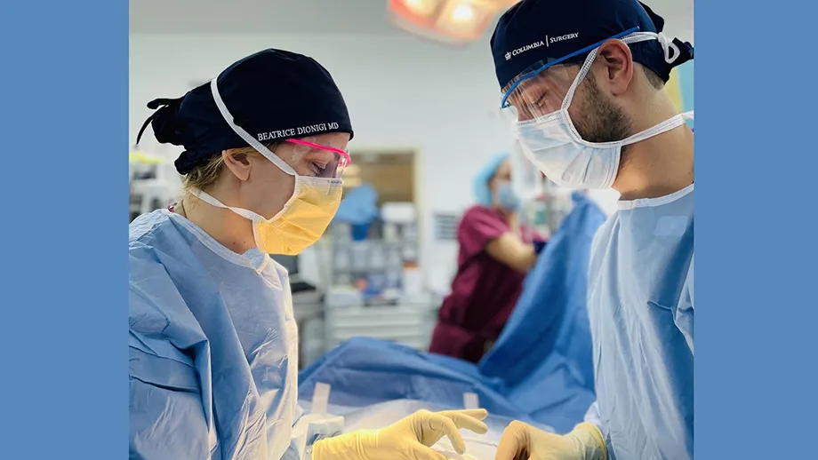 Photograph of Columbia surgeons Beatrice Dionigi and David Cohen as they obtain cells from colon cancer patients to create 3D organoids that they will study in the laboratory.